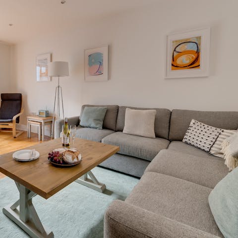 Stretch out in the comfy living area after a day on Portleven Beach