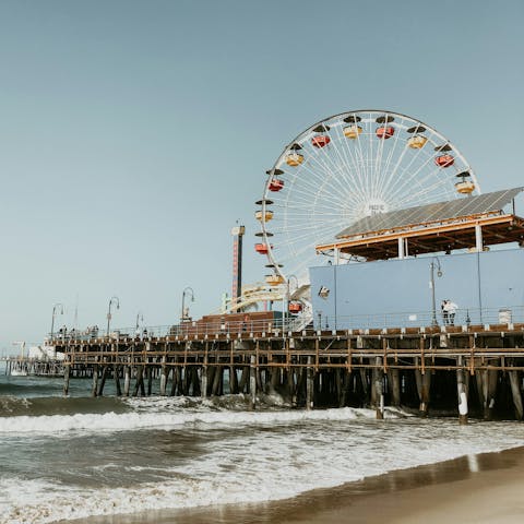 Enjoy strolls along Santa Monica Pier – a short drive away