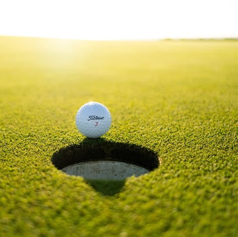 Hit a hole-in-one at Lauro Golf Resort, a short walk from home