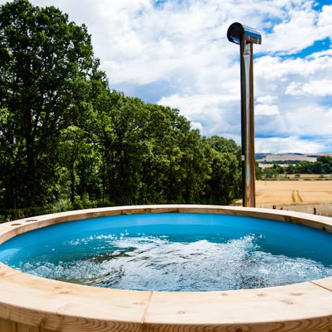 Let your cares melt away in the private wood-fired hot tub