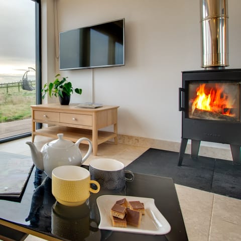 Sit back and relax with a cup of tea in front of the log-burning stove