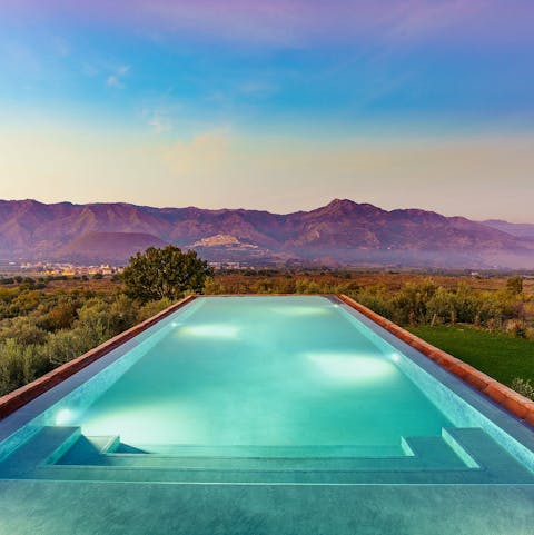 Admire Mount Etna while swimming in the private infinity pool