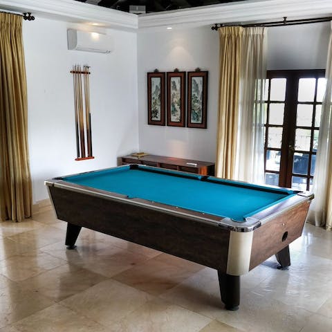 Test your pool skills at the villa's games room