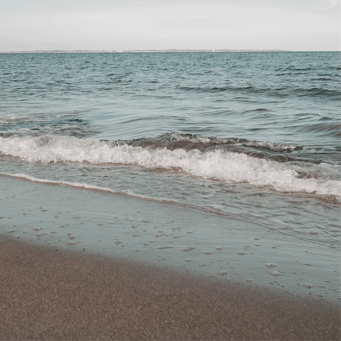 Spend the day sunbathing on Ambelas Beach, a ten-minute stroll away