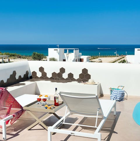 Admire the Mediterranean Sea views from the balcony