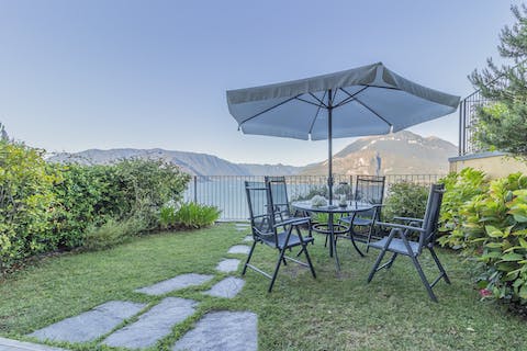 Dine alfresco in the private garden with views over Lake Como