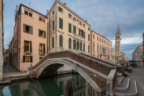 Stay along one of Venice's famous canals and take romantic gondola rides
