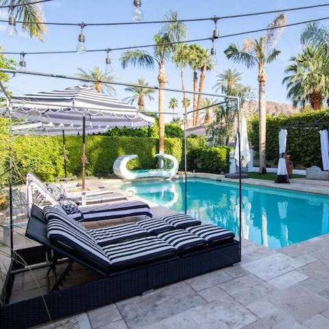 Spend glorious sunny days lounging by the pool