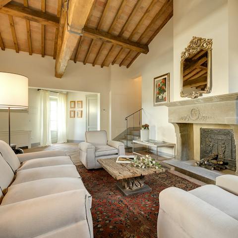 Gather in the formal living room for conversations and a glass of spumante in front of the stone hearth