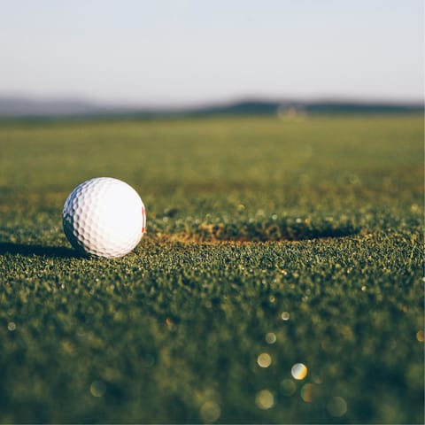 Practice your swing at the local golf course, just a four-minute drive away