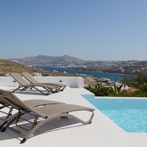 Lie back and relax in the Grecian sunshine on the poolside loungers