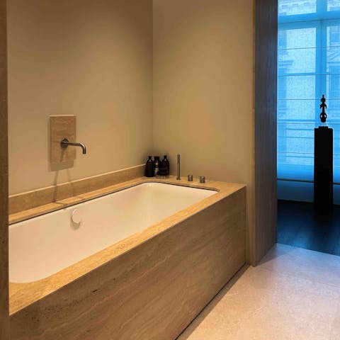 Relax your muscles with a long soak in the en-suite tub after a busy day