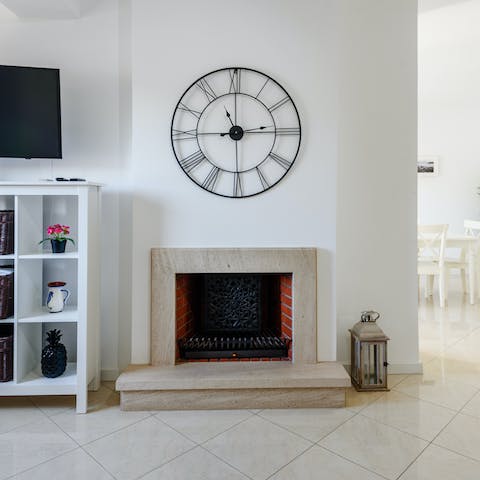 Relax amongst the home's quirky features, like this characterful fireplace