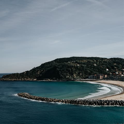 Surf, swim and sunbathe at Zurriola beach, a few hundred metres away