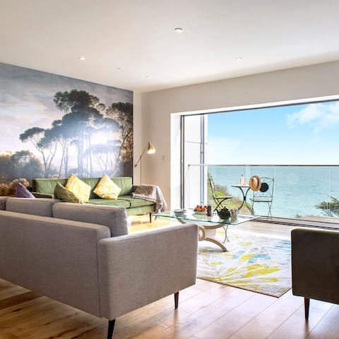 Admire the stunning views across the water from the sofa 
