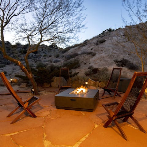 Warm up by the outdoor fire pit on cooler evenings