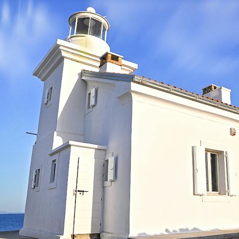Enjoy a home filled with history in a working lighthouse on the shore