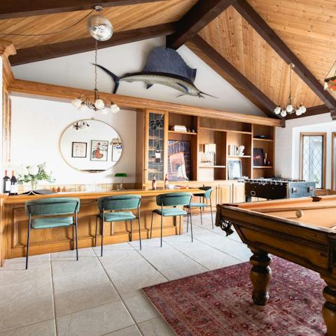 Uncork a bottle in the home's sociable bar and games room