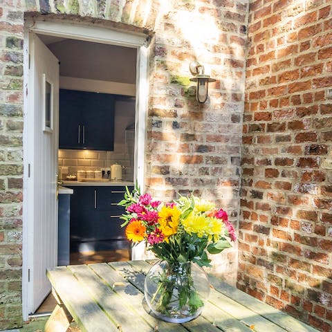 Savour morning coffees in the dappled sun