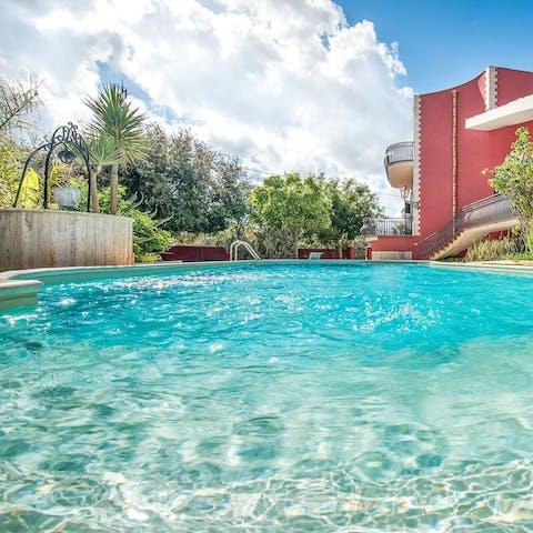 Enjoy cooling dips in the curvilinear pool, then dry off in the Sicilian sunshine