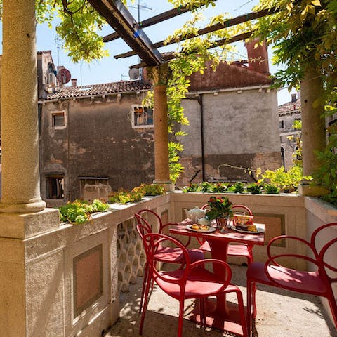 Sip your morning coffee under the Wisteria-wrapped trellace