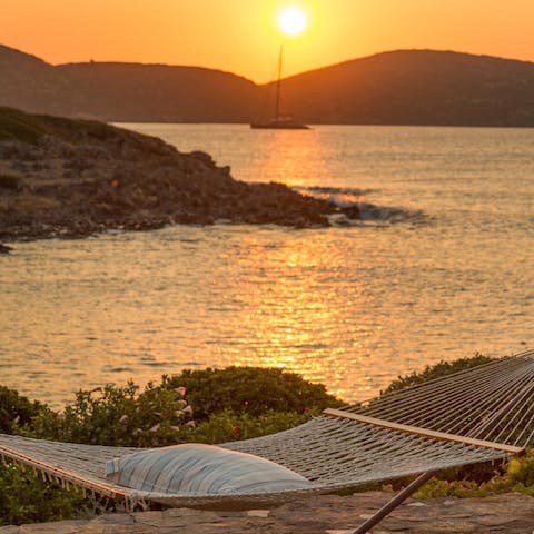 Chill out in the hammock and watch the sun set across the sea