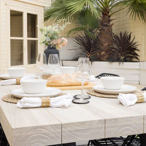 Gather together for sunny alfresco breakfasts and celebratory dinners around the garden's table