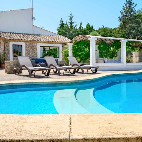 Swim in the private pool to cool off in the Mallorcan sun