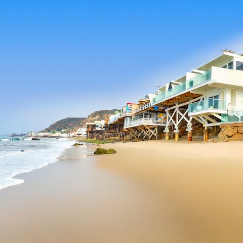 Hit the Malibu beach directly below the home in less than a minute