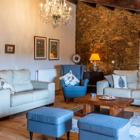 Snuggle up on one of the comfy sofas in the beautifully decorated living area 
