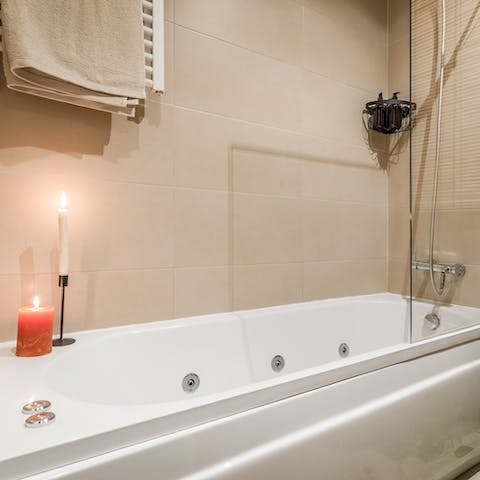 Light a couple of candles and run yourself an indulgent bubble bath in the tub 
