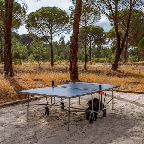 Play a heated game of table tennis as the wind blows through the Mediterranean pines 