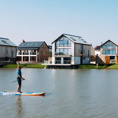 Hire out paddleboards from the activity hub to explore the surrounding lakes
