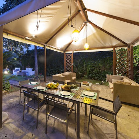 Enjoy a bit of alfresco dining in the covered patio area