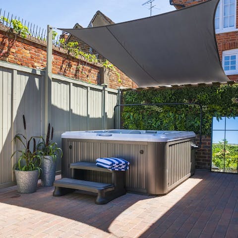 Take your relaxation to the next level as you kick back in this shaded hot tub
