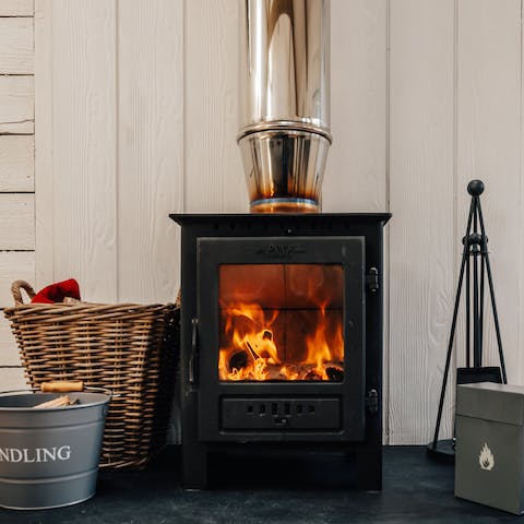 Cosy up in front of the wood-burning stove