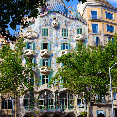 Visit Gaudí's colourful Casa Batlló, a five-minute walk away