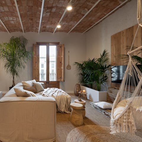 Hang out in the boho-chic living room with a glass of Spanish wine after a day of exploring the city