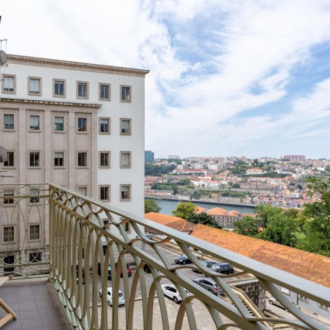 Admire views of the Douro River from the private balcony