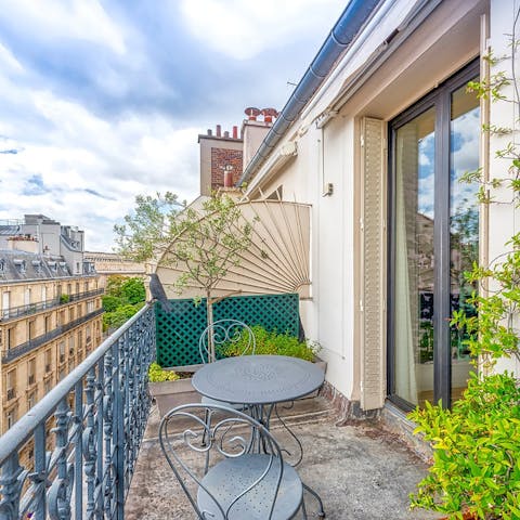 Admire the Haussmannian buildings as you sip a glass of wine on the balcony