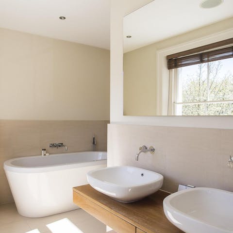 Relax and unwind in the freestanding bathtub in the ensuite master bathroom