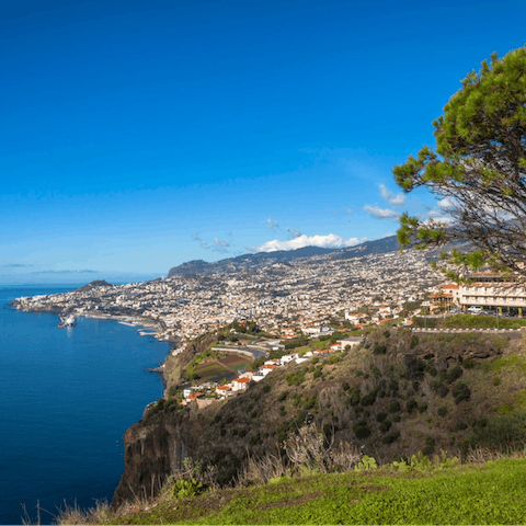 Stay on a hillside just above the capital city of Funchal