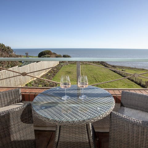 Soak up stunning sea views from the balcony with a cold glass of wine