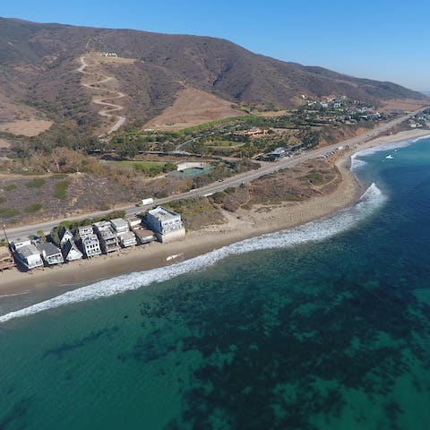 Savour the location of this incredible beachside home – just off the iconic PCH