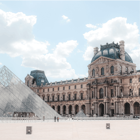 Admire artwork at The Louvre Museum, a four-minute walk away