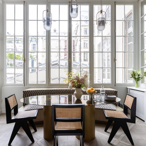 Sit down for a French meal in front of the large windows