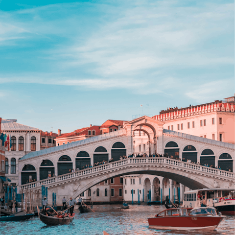 Visit the Rialto Bridge, a four-minute stroll from the apartment
