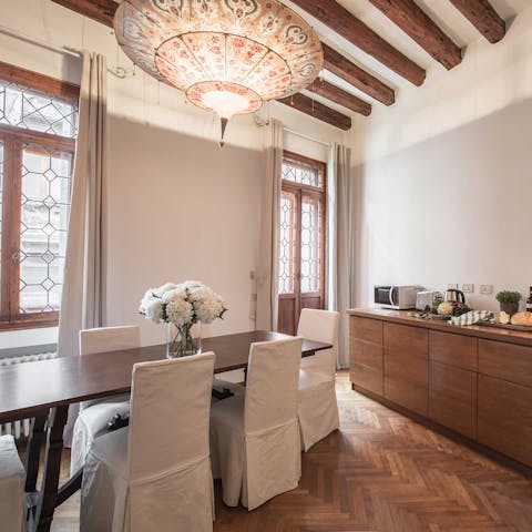 Eat and drink together in the open-plan kitchen dining area 