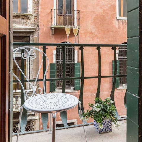 Enjoy a coffee on the private balcony overlooking the canal