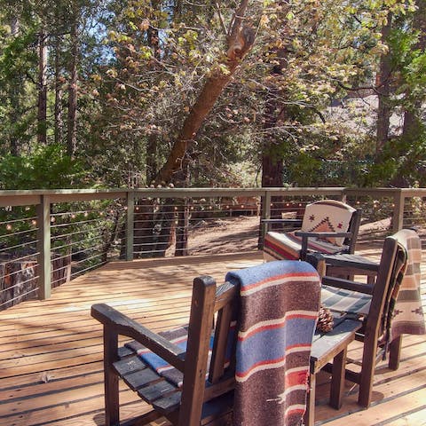 Admire the woodland views as you sip wine on the deck